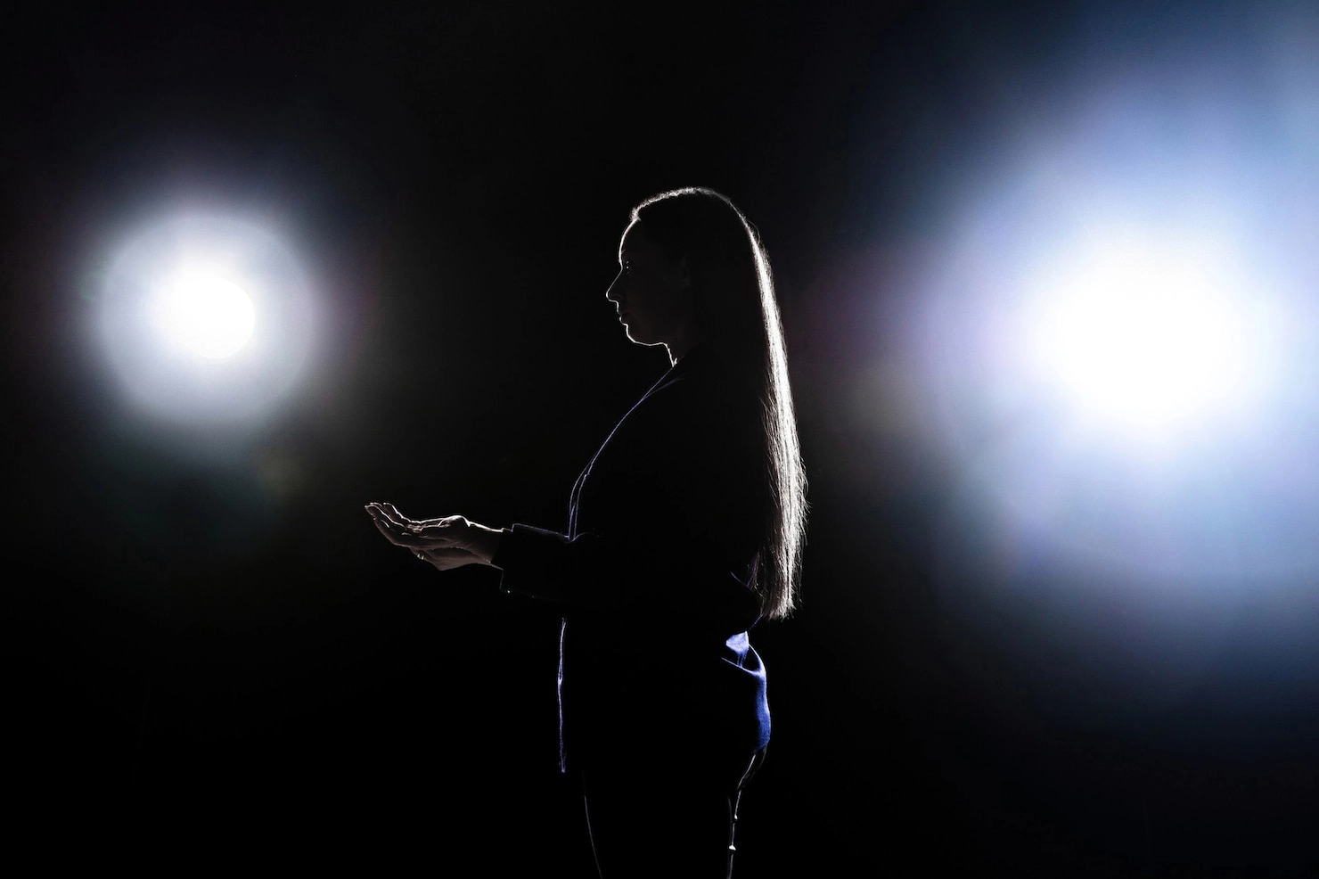 silhouette-young-woman-gesturing-isolated-black-wa